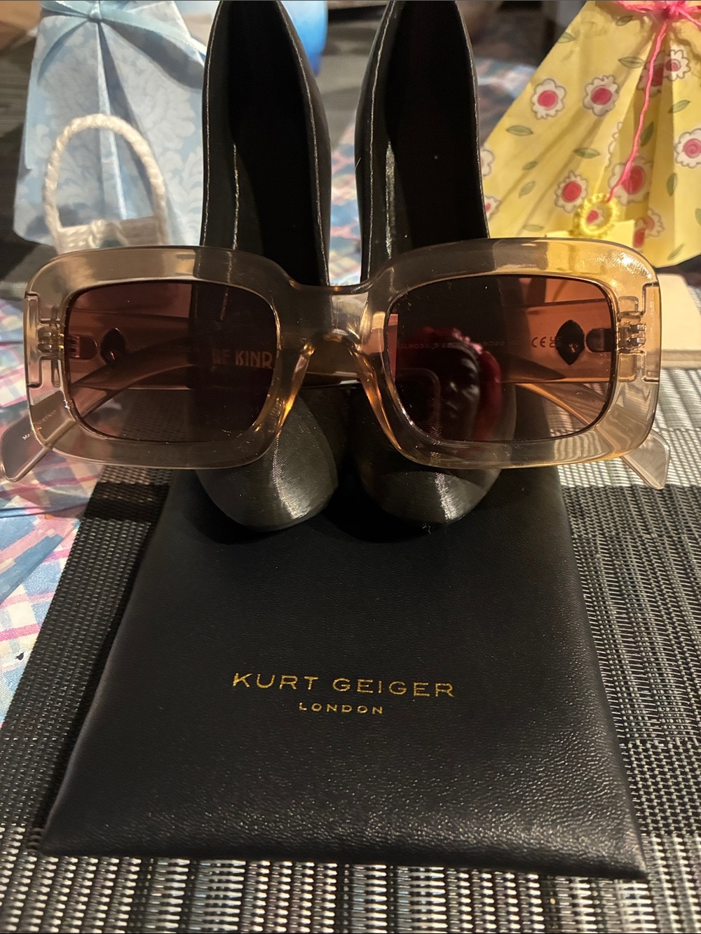 Kurt Geiger Transparent Frame Sunglasses with Brown Gradient Lenses with eagle